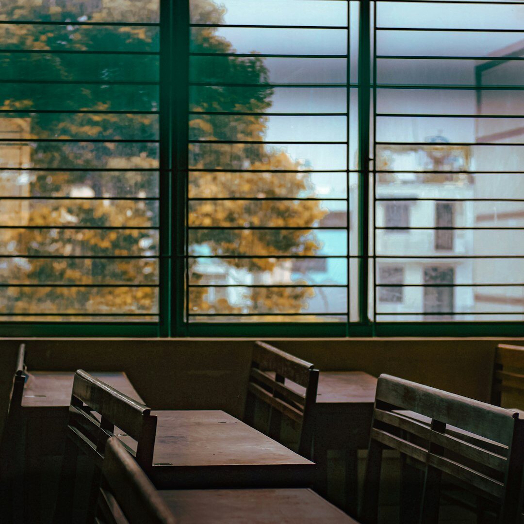 Bright modern learning space with tables and large windows