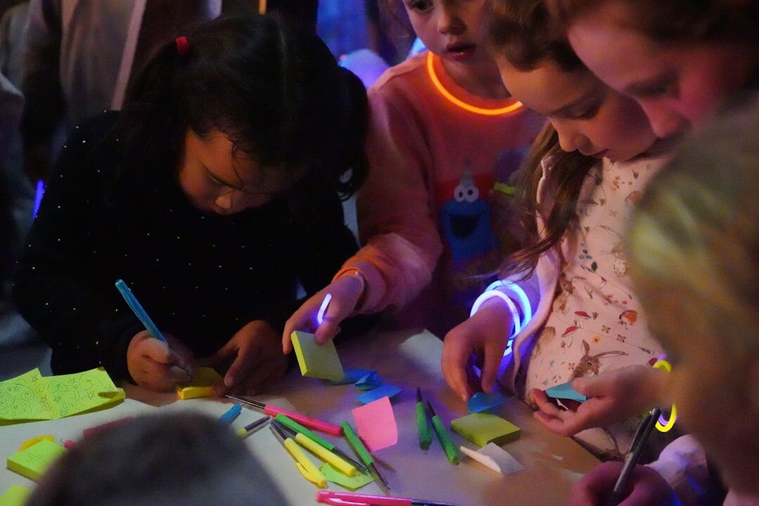 Small group collaborating around a table with notes and sticky notes